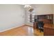 Home office with wood desk, chair, and hardwood floors at 4546 Nottoway Dr, Leesburg, FL 34748