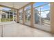 Spacious sunroom featuring large windows and a view of the backyard at 4546 Nottoway Dr, Leesburg, FL 34748