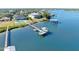 Aerial of waterfront home with private dock and boat at 59 Cunningham Dr, New Smyrna Beach, FL 32168