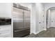 Stainless steel appliances and white shaker cabinets highlight this stunning kitchen at 59 Cunningham Dr, New Smyrna Beach, FL 32168