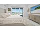 Main bedroom with water views and access to the patio at 59 Cunningham Dr, New Smyrna Beach, FL 32168