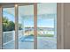 View from the patio shows a spa, pool, and river access at 59 Cunningham Dr, New Smyrna Beach, FL 32168