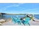 Relaxing patio with fire pit and waterfront views at 59 Cunningham Dr, New Smyrna Beach, FL 32168