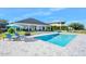 Large pool and patio area with lounge chairs at 59 Cunningham Dr, New Smyrna Beach, FL 32168