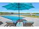 Inviting pool area with lounge chairs and water views at 59 Cunningham Dr, New Smyrna Beach, FL 32168