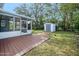 Backyard with deck, shed, and screen porch at 142 Seton Trl, Ormond Beach, FL 32176