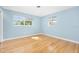 Bedroom with hardwood floors and light blue walls at 142 Seton Trl, Ormond Beach, FL 32176