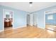 Bedroom with hardwood floors, mirrored closet, and ensuite bathroom at 142 Seton Trl, Ormond Beach, FL 32176