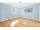 Bright bedroom with hardwood floors and light blue walls at 142 Seton Trl, Ormond Beach, FL 32176