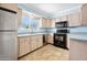 Kitchen with stainless steel appliances and light wood cabinets at 142 Seton Trl, Ormond Beach, FL 32176