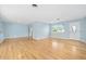 Bright living room featuring hardwood floors and light blue walls at 142 Seton Trl, Ormond Beach, FL 32176