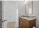 Small bathroom with granite countertop and wood cabinets at 149 Sunrise Cove Cir, Ormond Beach, FL 32176