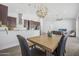 Dining area with a modern light fixture and seating for six at 149 Sunrise Cove Cir, Ormond Beach, FL 32176