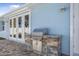 Built-in outdoor kitchen with stainless steel grill at 149 Sunrise Cove Cir, Ormond Beach, FL 32176