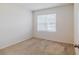 Simple bedroom with carpeted floor and window at 200 Duke Dr, Deland, FL 32724