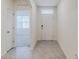 Bright and airy entryway with tile flooring and neutral tones at 200 Duke Dr, Deland, FL 32724