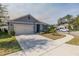 Two-car garage and nicely landscaped front yard at 200 Duke Dr, Deland, FL 32724