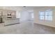 Bright and airy living room with tile floors and kitchen access at 200 Duke Dr, Deland, FL 32724