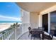 Ocean view balcony with table and chairs at 2403 S Atlantic Ave # 309, Daytona Beach, FL 32118