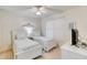 Bedroom with twin beds, nightstands, ceiling fan, and TV at 2403 S Atlantic Ave # 309, Daytona Beach, FL 32118