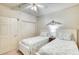 Guest bedroom with twin beds and white dresser at 2403 S Atlantic Ave # 309, Daytona Beach, FL 32118