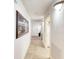 Bright hallway with tile floors and artwork at 2403 S Atlantic Ave # 309, Daytona Beach, FL 32118