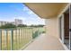 Private balcony overlooking a golf course and residential buildings at 4 Oceans West Blvd # 206C, Daytona Beach, FL 32118