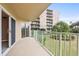 Balcony with view of the landscaped grounds and neighboring building at 4 Oceans West Blvd # 206C, Daytona Beach, FL 32118