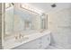 Bright bathroom with double vanity and a separate shower and tub at 4 Oceans West Blvd # 206C, Daytona Beach, FL 32118