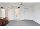 Simple bedroom with carpet flooring and access to bathroom at 4 Oceans West Blvd # 206C, Daytona Beach, FL 32118