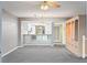 Bright dining room with a view of the kitchen and built-in shelving at 4 Oceans West Blvd # 206C, Daytona Beach, FL 32118