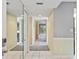 Bright condo entryway with mirrored closet and carpeted floors at 4 Oceans West Blvd # 206C, Daytona Beach, FL 32118