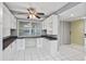 Built-in office space with white cabinets and granite countertops at 4 Oceans West Blvd # 206C, Daytona Beach, FL 32118