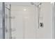 Clean shower stall with multiple shower heads and storage shelves at 4 Oceans West Blvd # 206C, Daytona Beach, FL 32118