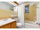 Clean bathroom with shower/tub and wood cabinets at 67 Ormond Shores Dr, Ormond Beach, FL 32176