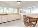 Charming breakfast nook with wood table and chairs, adjacent to kitchen at 67 Ormond Shores Dr, Ormond Beach, FL 32176