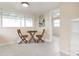 Small dining area with table and chairs near an interior door at 67 Ormond Shores Dr, Ormond Beach, FL 32176