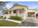 Charming bungalow style home with carport and well-maintained landscaping at 67 Ormond Shores Dr, Ormond Beach, FL 32176