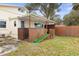 House exterior showcasing a wooden deck and ramp at 67 Ormond Shores Dr, Ormond Beach, FL 32176