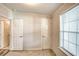 Bedroom with two doors and window at 718 Casper Ave, Port Orange, FL 32129