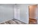 Bedroom with double door closet and laminate wood flooring at 718 Casper Ave, Port Orange, FL 32129