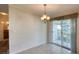 Bright dining area with tiled floor and access to a patio at 718 Casper Ave, Port Orange, FL 32129