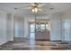 Living room with laminate flooring and a view into kitchen area at 718 Casper Ave, Port Orange, FL 32129