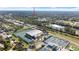 Aerial view of home near tennis courts at 825 Magnolia Ave, Holly Hill, FL 32117