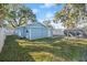 Landscaped backyard with shed and hammock at 825 Magnolia Ave, Holly Hill, FL 32117