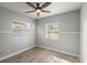 Cozy bedroom with ceiling fan and wood-look floors at 825 Magnolia Ave, Holly Hill, FL 32117