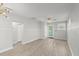 Bright and airy living room with light gray walls and tile flooring at 825 Magnolia Ave, Holly Hill, FL 32117