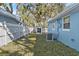 Side yard with shed and AC unit at 825 Magnolia Ave, Holly Hill, FL 32117