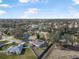 Aerial view of neighborhood, showcasing houses and street at 92 Spinnaker Cir, South Daytona, FL 32119