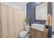 Bathroom with blue accent wall and a modern vanity at 92 Spinnaker Cir, South Daytona, FL 32119